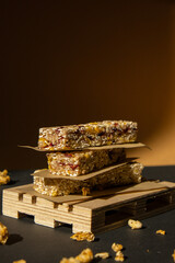 Homemade Granola energy bar. Variety of homemade protein granola breakfast bars with nuts, raisins dried cherries and chocolate. Healthy nutrition eating Gluten free cereal dieting snack super food