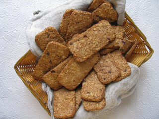 Muesli cookies in a basket with napkin