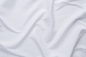 White fabric. luxurious white fabric texture background. Creases of satin, silk and cotton.	