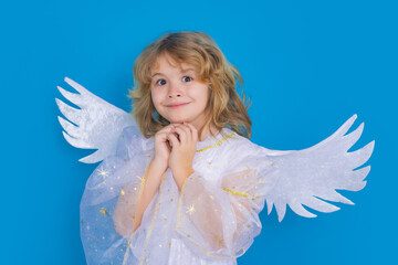 Christmas kids. Little cupid angel child with wings. Studio portrait of angelic kid.