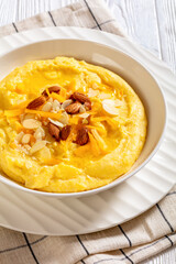 corn grits with butter, vegan cheese, and almonds