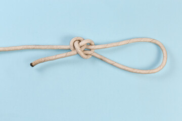 Untightened rope Angler's loop on a blue background