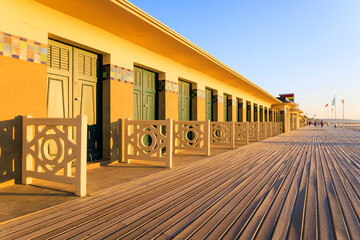 The famous beach cabins of the promenade des Planches in Deauville. Normandy, France. - obrazy, fototapety, plakaty