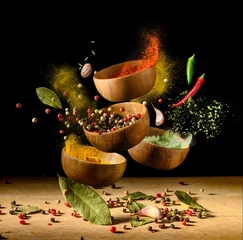 Fototapeten Spices and seasonings powder splash, explosion on black © Soho A studio