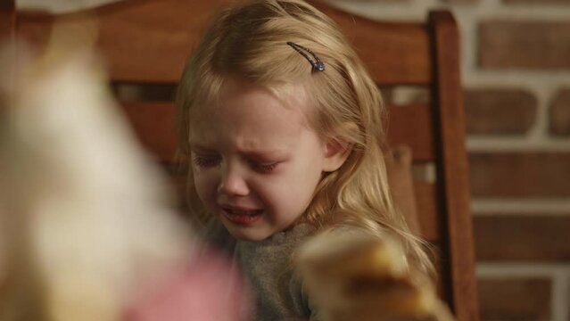 Sad Cute Birthday Girl Wants To Eat A Piece Of Cake But Parents Forbid, Crying Kid. Sweets Obsessed Child. Preventing Children From Eating Junk Food, Parenting Problems. Healthy Food Concept. HQ 4k