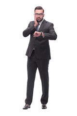 Fototapeta premium full length . Executive businessman looking at his wristwatch