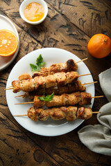 Homemade chicken skewers with orange