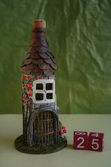 Decorative fairy-tale vintage house tower in form of bottle and red wooden cubes number 25. DIY....