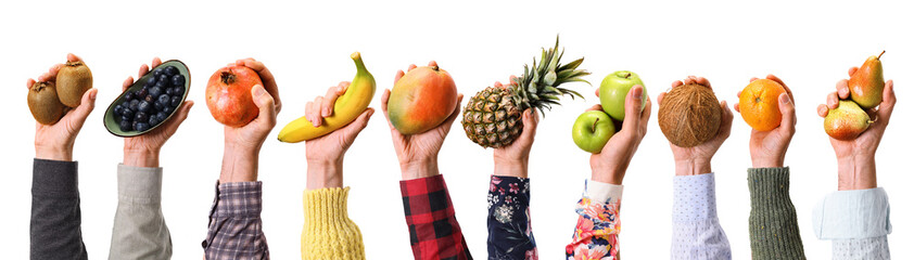 Fruity banner of different fruits in a row in hands.
