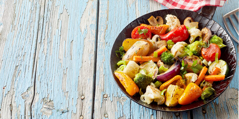 Bowl with grilled vegetables on frying pan