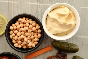 Bowl of hummus and bowl of chickpeas 