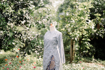 The bride's sage green wedding gown was photographed outdoors