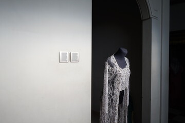 the white wedding dress of the bride was photographed with a monochrome theme
