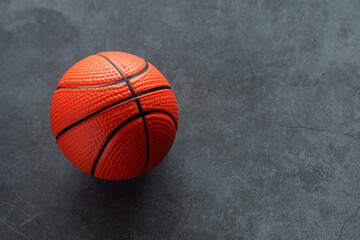 Small soft foam basketball on dark background