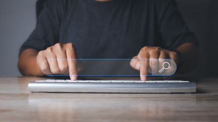 Man using computer searching browsing internet data information networking.