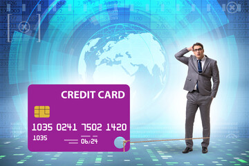 Businessman in the credit card debt concept