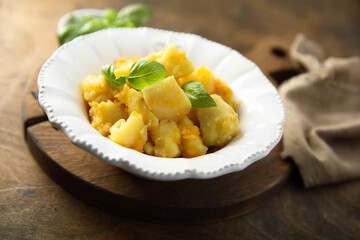 Braised potato with carrot and onion