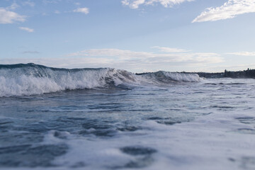 Small wave breaking on the shore.