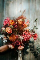 Beautiful rustic bouquet on wooden door background