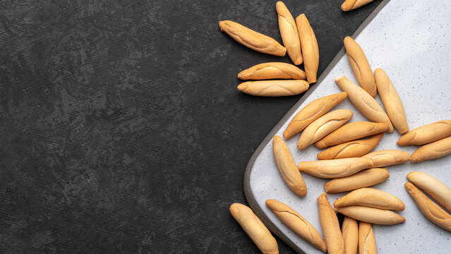 Flat lay with picos - bread sticks on the dark background with Copy space