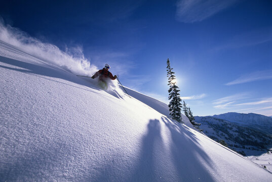 Man skiing deep powder in Utah.