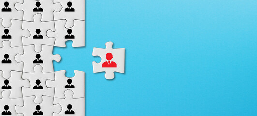 Human resources and management concept, puzzle pieces with business people icon on blue background