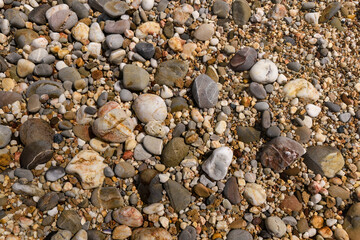 Colorful beach rocks, close up background.