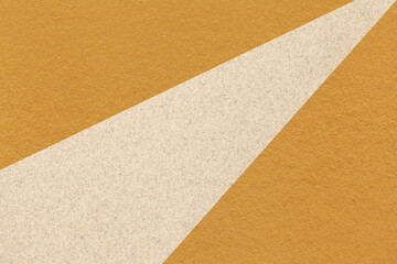 Texture of old craft dark yellow color paper background with beige line, macro. Vintage abstract...