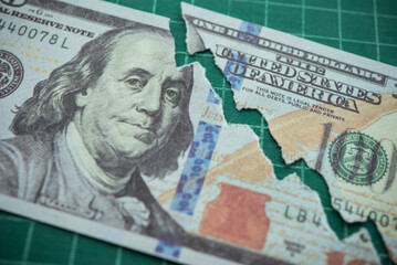Tear off US dollar bill banknote as chart graph falling down. The Federal Reserve ( FED ) increase % interest rates to fix inflation crisis. World global economy recession and stagflation concept. - obrazy, fototapety, plakaty