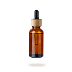Glass dropper bottle with cap of bamboo wood for face serum or essential oil or pharmaceutical...