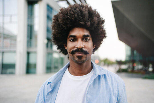 Portrait Of Positive Happy African American Man Standing In the City