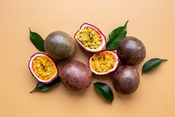 Flatlay of whole and half of fresh passion fruit - marakuya