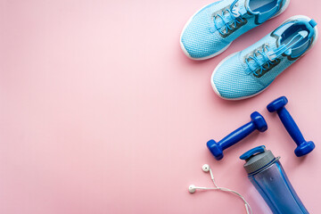 Naklejka na ściany i meble Sneakers and dumbbells for workout sport flatlay background