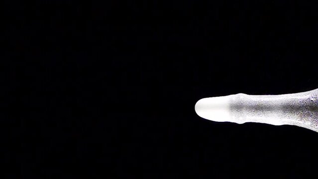 Super slow motion shot of champagne explosion, opening champagne bottle closeup. Filmed on high speed cinema camera, 4k1000fps