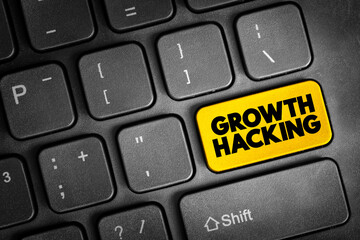 Fototapeta premium Growth Hacking - subfield of marketing focused on the rapid growth of a company, text button on keyboard