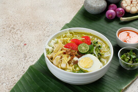 soto ayam, chicken soup with a yellow sauce