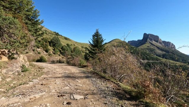 Get off the road recreation dirt road on top of the mountain POV. Nature, landscape and picturesque environment of mountains and forests. Outdoor fun, exploration and entertainment. Viewpoint.
