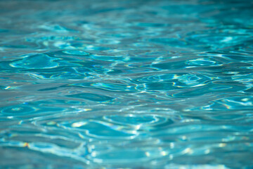 Tansparent clear calm water surface texture. Abstract nature background. Sea water pattern.