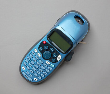 Modern label writer on grey background