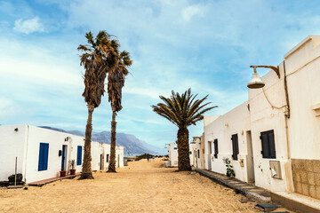 Sandy streets and white houses in Caleta del Sebo, La Graciosa, Canary Islands