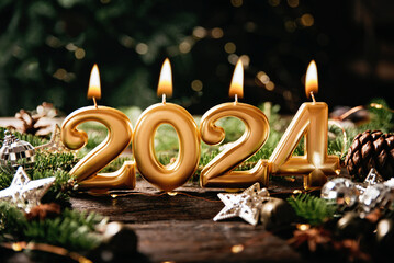 Holiday background Happy New Year 2024. Numbers of year 2024 made by gold burning candles on bokeh festive sparkling background. celebrating New Year holiday, close-up. Space for text