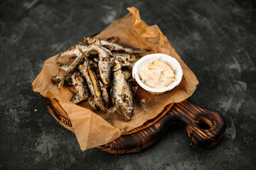fried vendace on craft paper and cutting board northern cuisine
