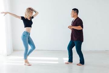 Fototapeta premium pair dance latin training loving dancers training in bachata kizomba dance hall