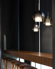 Roller blinds in the cafe. Solar shades black color in the urban style interior. Wooden table near...