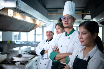 Portrait of a group of chefs and culinary students in the culinary Institute's kitchen.