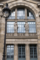Fototapeta na wymiar Architectural fragments of North Station (Gare du Nord, 1864) - one of the six large termini in Paris, largest and oldest railway stations in Paris. France.