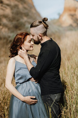 pregnant girl and boyfriend on high hills