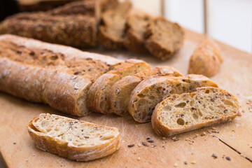 fresh loaf of bread on wooden board