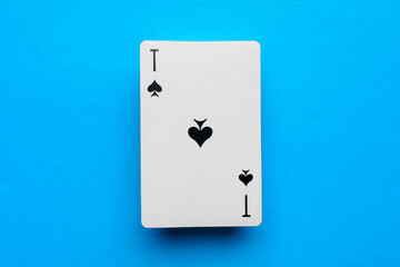 Playing card ace of spades on a blue background