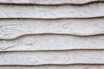 Background, texture of a wall, a fence made of gray concrete, stone. Closeup photography, abstraction, copy space.